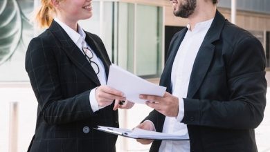 businessman-businesswoman-holding-documents-hands_23-2147972825-5951448