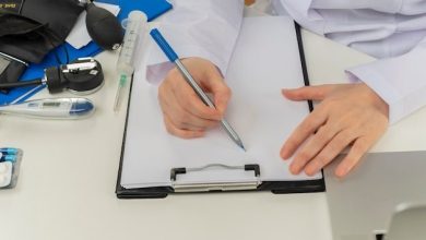 cropped-shot-female-doctor-hands-working-desk-with-medical-tools-laptop-writing-prescription-clipboard_141793-69192-8515831